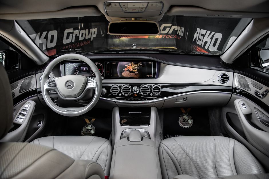 Explore the premium interior of a Mercedes-Benz S-Class, showcasing luxurious leather seats and advanced technology.